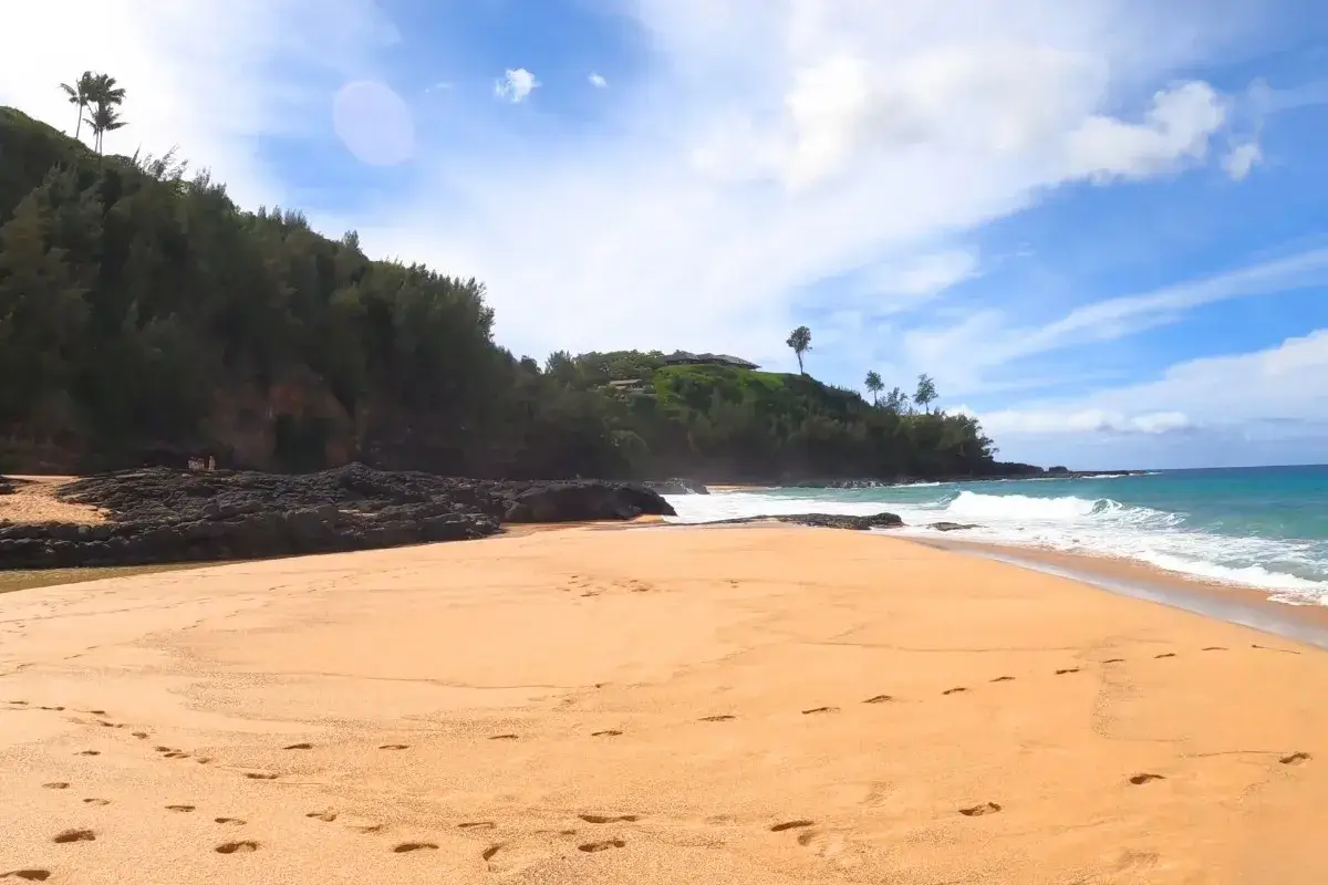 Wild scenic coastline representing Secret Beach Kauapea on Kauai